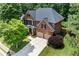 Charming two-story brick home with a well-manicured lawn and a two-car garage at 1085 Highland Crest Ct, Mableton, GA 30126