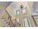 Grand foyer with high ceilings, staircase, and large windows with plantation shutters at 1085 Highland Crest Ct, Mableton, GA 30126