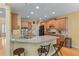 Kitchen with granite countertops, stainless steel appliances, breakfast bar, and wood cabinetry at 1085 Highland Crest Ct, Mableton, GA 30126