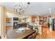 Open floor plan features the kitchen with breakfast bar, dining area, and living room with fireplace at 1085 Highland Crest Ct, Mableton, GA 30126