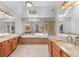Bright owner's bathroom with dual sinks, soaking tub, skylights, and a glass shower at 1085 Highland Crest Ct, Mableton, GA 30126