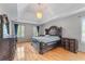 Elegant owner's suite features tray ceiling, hardwood floors, and large windows at 1085 Highland Crest Ct, Mableton, GA 30126