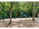 Community playground featuring swings, slides, and climbing structures, perfect for Gathering fun and recreation at 1085 Highland Crest Ct, Mableton, GA 30126