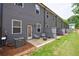Backyard patio with chairs and green grass at 1624 Gunnin Nw Trce, Atlanta, GA 30318