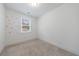 Bright carpeted bedroom with flower decals, and a single window for natural light at 1624 Gunnin Nw Trce, Atlanta, GA 30318