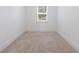 A bright bedroom with neutral carpet, window, and a fresh, clean look at 1624 Gunnin Nw Trce, Atlanta, GA 30318
