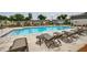 A refreshing community pool surrounded by lounge chairs, tables, and well maintained landscaping at 1624 Gunnin Nw Trce, Atlanta, GA 30318