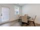 Dining area featuring modern lighting, neutral colors, hardwood flooring and a backyard door at 1624 Gunnin Nw Trce, Atlanta, GA 30318