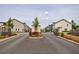 A community entrance gate that opens to new townhomes and lush landscaping at 1624 Gunnin Nw Trce, Atlanta, GA 30318