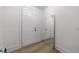 Hallway featuring wood-look floors and white trim at 1624 Gunnin Nw Trce, Atlanta, GA 30318