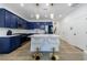 Stylish kitchen featuring blue cabinets, white countertops, stainless steel appliances, and bar stool seating at 1624 Gunnin Nw Trce, Atlanta, GA 30318