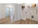 Spacious laundry area with shelving, washer and dryer connections, and durable wood flooring at 1624 Gunnin Nw Trce, Atlanta, GA 30318