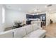 Open-concept living room and kitchen area with hardwood floors, recessed lighting and stainless appliances at 1624 Gunnin Nw Trce, Atlanta, GA 30318