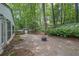 Relaxing backyard with a stone patio and lush trees providing a tranquil outdoor space at 2858 Mornington Nw Dr, Atlanta, GA 30327