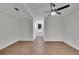 Bright basement area with wood flooring, a ceiling fan, and a window offering natural light at 2858 Mornington Nw Dr, Atlanta, GA 30327