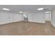 Open basement area with wood flooring, multiple doors, and recessed lighting providing great potential at 2858 Mornington Nw Dr, Atlanta, GA 30327