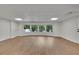 Spacious basement area with wood flooring, recessed lighting, and large windows providing natural light at 2858 Mornington Nw Dr, Atlanta, GA 30327