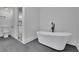 Elegant bathroom features a standalone tub and sleek fixtures at 2858 Mornington Nw Dr, Atlanta, GA 30327