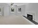 Spacious bedroom with neutral carpet, fireplace and large windows offering natural light at 2858 Mornington Nw Dr, Atlanta, GA 30327