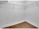 Walk-in closet with hardwood floors and wire shelving, offering ample storage space at 2858 Mornington Nw Dr, Atlanta, GA 30327