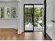 Stylish foyer with a modern glass door, white trim, and warm hardwood floors at 2858 Mornington Nw Dr, Atlanta, GA 30327