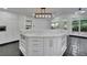 Kitchen island with marble countertop, ample storage, and natural light at 2858 Mornington Nw Dr, Atlanta, GA 30327