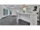 Open kitchen layout with marble countertops, tile floors, and large windows at 2858 Mornington Nw Dr, Atlanta, GA 30327
