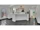 Bright kitchen with island, modern lighting, and stainless steel appliances at 2858 Mornington Nw Dr, Atlanta, GA 30327