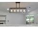 Modern lighting fixture above marble countertop, next to large windows at 2858 Mornington Nw Dr, Atlanta, GA 30327