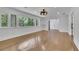 Large living room with hardwood floors, recessed lighting and large windows with private backyard views at 2858 Mornington Nw Dr, Atlanta, GA 30327