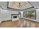 Bright living room featuring hardwood floors, a marble fireplace, recessed lighting, and large windows at 2858 Mornington Nw Dr, Atlanta, GA 30327
