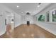Bright living room with hardwood floors, fireplace, built-in shelving and large windows with backyard views at 2858 Mornington Nw Dr, Atlanta, GA 30327