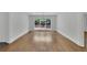 Living room featuring hardwood floors, recessed lighting and large windows with private backyard views at 2858 Mornington Nw Dr, Atlanta, GA 30327