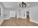 Spacious living room features hardwood floors, modern ceiling fan, and multiple entryways at 2858 Mornington Nw Dr, Atlanta, GA 30327