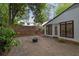 Private stone patio with room to entertain, features a fire pit, and views of the yard at 2858 Mornington Nw Dr, Atlanta, GA 30327