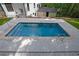 Inviting backyard pool with a stone edge, providing a refreshing oasis with a clear view of the house at 2858 Mornington Nw Dr, Atlanta, GA 30327