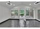 Bright sunroom featuring large windows, tile floors, and access to the backyard at 2858 Mornington Nw Dr, Atlanta, GA 30327