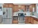 Efficient kitchen with stainless steel appliances and wood cabinetry at 332 Shadowmoor Dr, Decatur, GA 30030