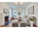 Bright living room featuring a decorative fireplace, hardwood floors, and ample natural light at 332 Shadowmoor Dr, Decatur, GA 30030