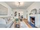 Bright living room featuring a fireplace, hardwood floors, and contemporary lighting at 332 Shadowmoor Dr, Decatur, GA 30030