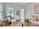 Cozy living room with a fireplace, hardwood floors, and neutral-toned furniture at 332 Shadowmoor Dr, Decatur, GA 30030