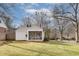 View of the rear of the home featuring a screened in porch and a large yard at 332 Shadowmoor Dr, Decatur, GA 30030