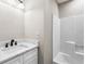 This bathroom features a sleek vanity with marble countertop and a shower-tub combination at 3589 Hopkins Ct, Powder Springs, GA 30127