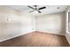 Bright bedroom with hardwood floors and a ceiling fan at 3589 Hopkins Ct, Powder Springs, GA 30127