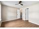 This expansive bedroom includes wood-look flooring, neutral walls, and bright white doors and trim at 3589 Hopkins Ct, Powder Springs, GA 30127