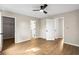 This large bedroom includes neutral walls, wood-look flooring, and modern ceiling fan at 3589 Hopkins Ct, Powder Springs, GA 30127