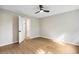 A light filled bedroom features a contemporary ceiling fan and wood-look flooring at 3589 Hopkins Ct, Powder Springs, GA 30127