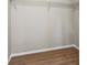 Walk-in closet with wire shelving and wood-look flooring at 3589 Hopkins Ct, Powder Springs, GA 30127