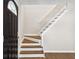 Entryway featuring a staircase with hardwood stairs and a white banister at 3589 Hopkins Ct, Powder Springs, GA 30127