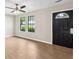 Inviting living room with beautiful hardwood floors and ample sunlight at 3589 Hopkins Ct, Powder Springs, GA 30127